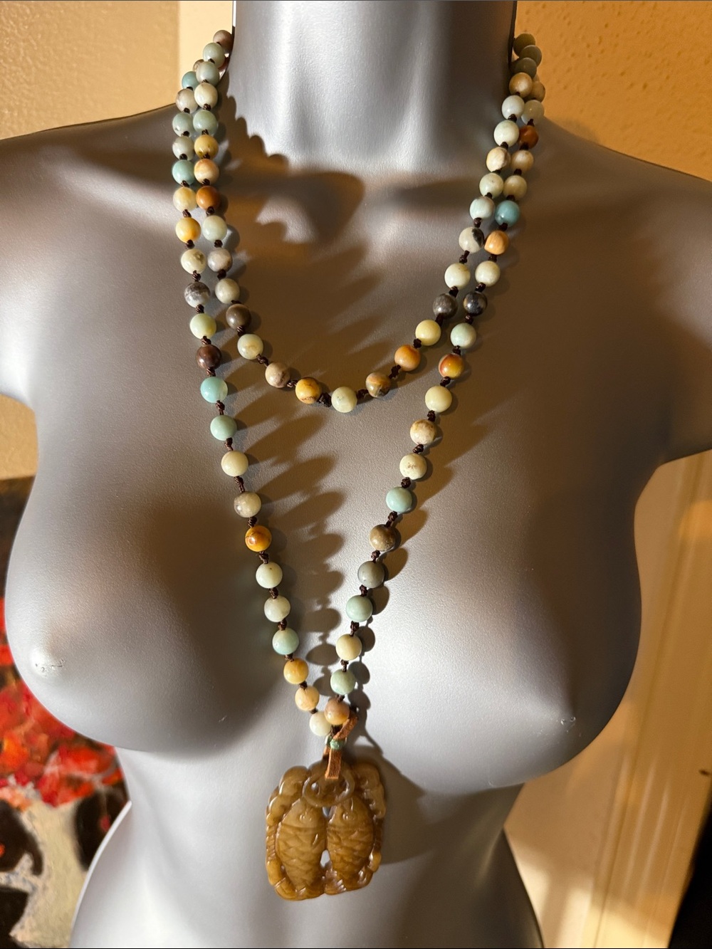 Jadeite Fish Pendant on a 23” drop hand knotted bead necklace